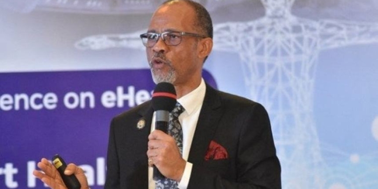 Man standing and holding a microphone