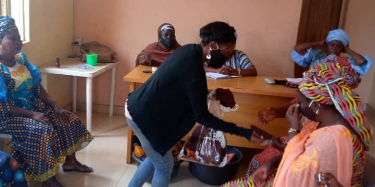 COVID-19 – Gender Advocate Distributes Face Masks To Market Women