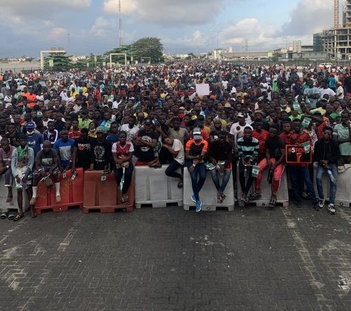Image of a lot of people, endsars protesters gathered outdoor at lekki toll