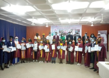 People Standing with certificates in their hand