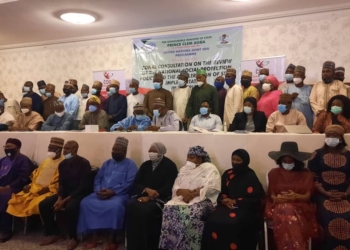 A group picture of participants at the meeting with a banner which illustrated the details of the meeting