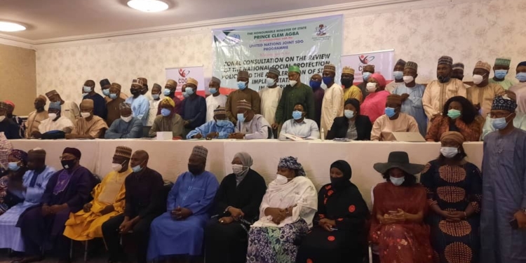 A group picture of participants at the meeting with a banner which illustrated the details of the meeting