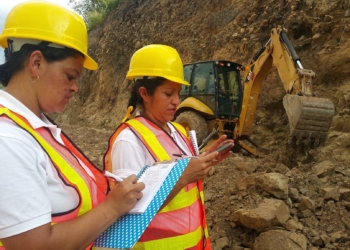 2 women who are dressed as site workers on a construction site