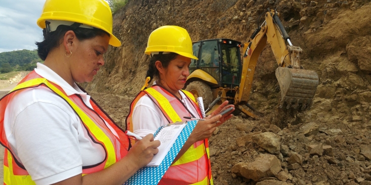 2 women who are dressed as site workers on a construction site