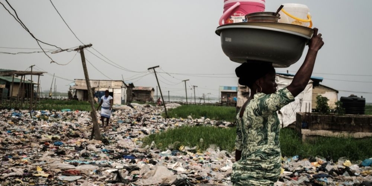 A woman hawking food to sell in a slum area