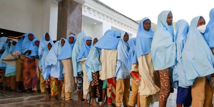 Girls on a queue walking towards the hall