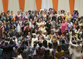 Many women taking group photograph