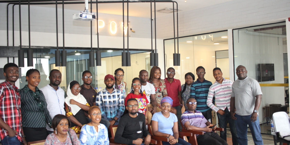 Group of people in a picture - some are seated and some are standing