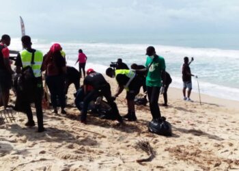 People cleaning the waterfront