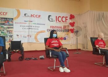 three men and one lady seated in a podium as panel members
