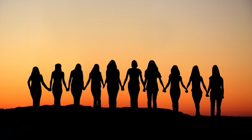 Silhouette of women holding hands. Source - Pinterest