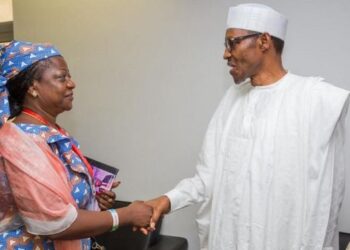 Man looking at a woman and both shaking hands