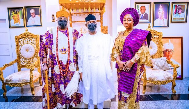 2 men and one woman standing together in a picture