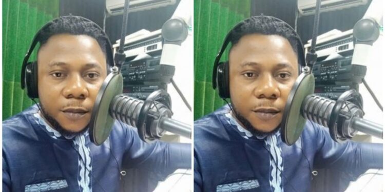 A man sitting and speaking to a microphone