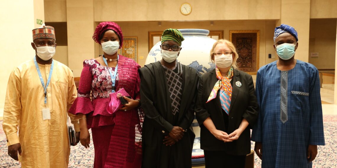 Group picture, all wearing face mask