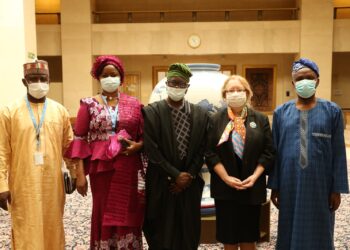Group picture, all wearing face mask