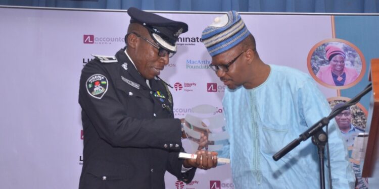 A man giving an award to a police officer