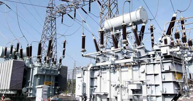 Outdoor electricity transformer with wire poles over it