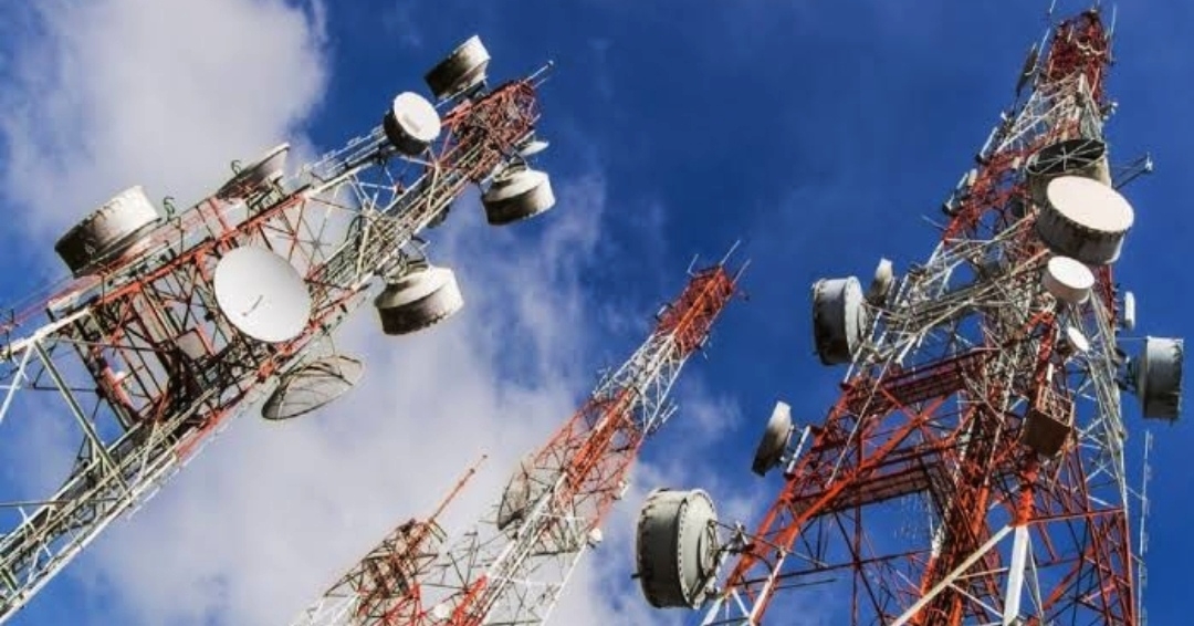 Tall telecoms masts view fromm bottom showing a blue sky above