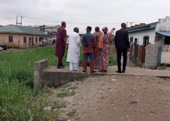 Residents of the community inspecting the flood prone areas