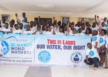 People in a group picture and those in front are holding a banner which reads -This is Lagos, Our Water Our Right