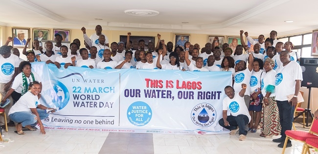 People in a group picture and those in front are holding a banner which reads -This is Lagos, Our Water Our Right