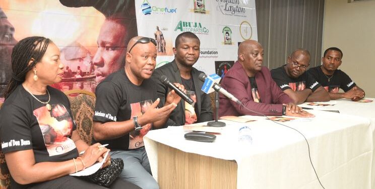 People seated facing a table