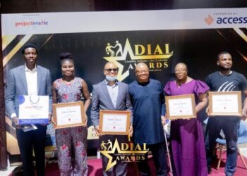 People in a group picture holding certificates