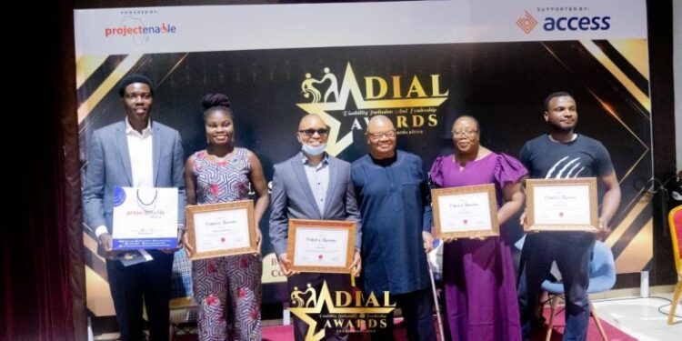 People in a group picture holding certificates