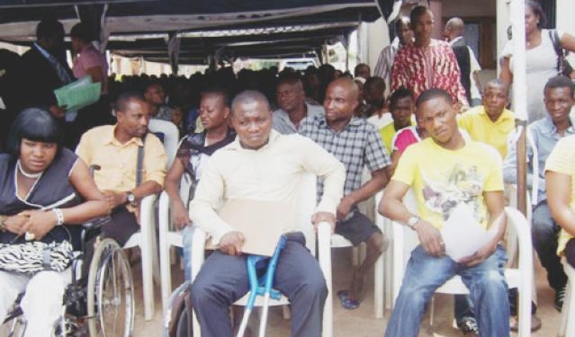 people with disabilities sitting outdoor under a shelter