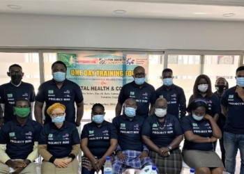 People in a group picture, some are seated while some are standing