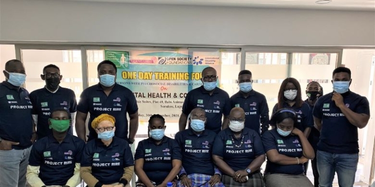 People in a group picture, some are seated while some are standing