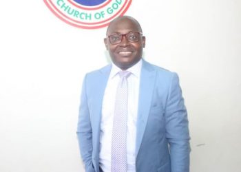 A man standing and the logo of the