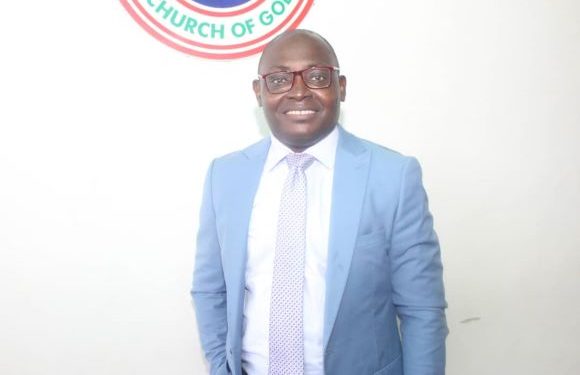 A man standing and the logo of the