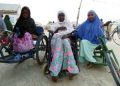 Three women on wheel chairs outdoor. They have hijabs on