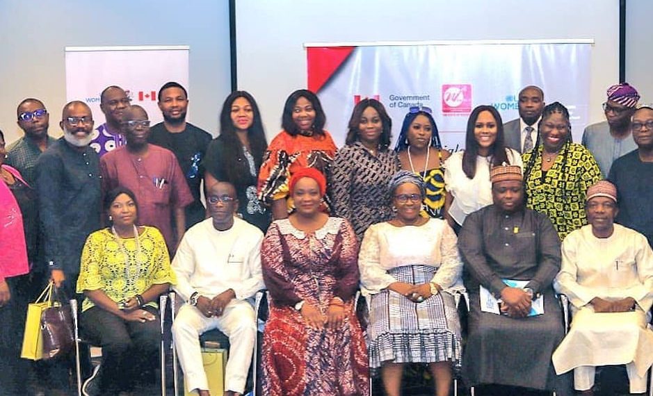 People in a group picture, some are seated while some are standing