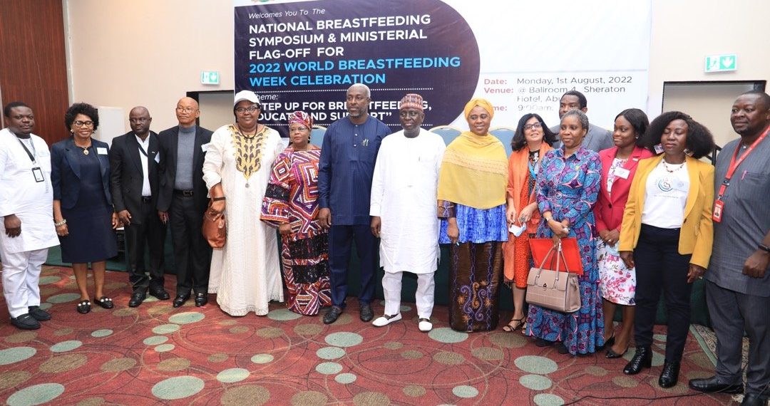 A group of people standing indoor