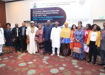 A group of people standing indoor
