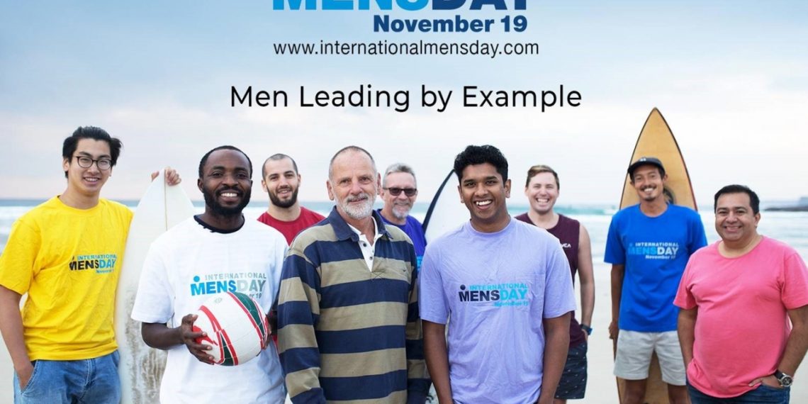 Image of nine men standing outdoor