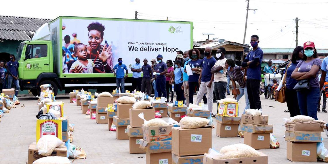 The image of food packs and a bus reading 'we deliver hope'