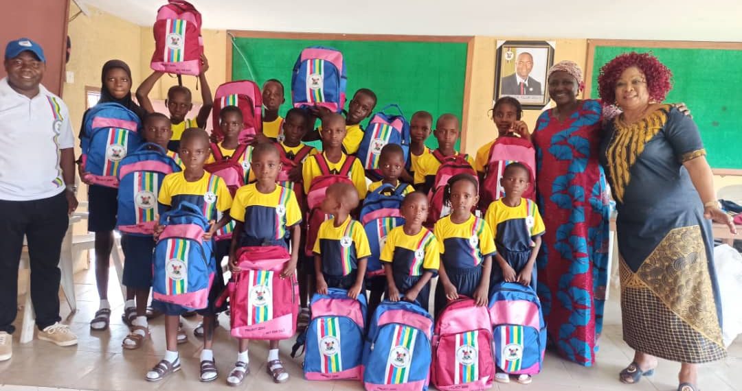 Children with their new uniforms and some of their parents