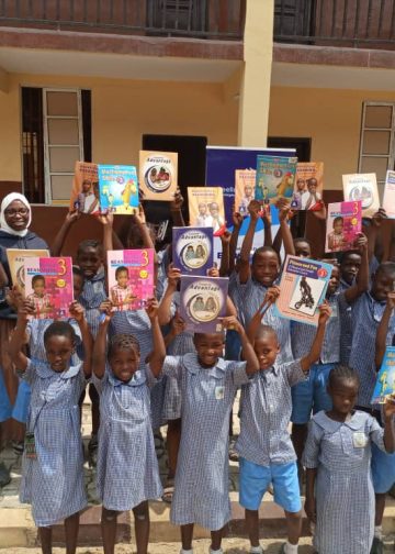 Pupils of Central Primary School and Ikeja Primary School after receiving books and bags from Beellahy Foundation.
