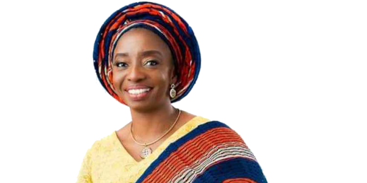 A woman wearing a warm smile with a purse in her hand