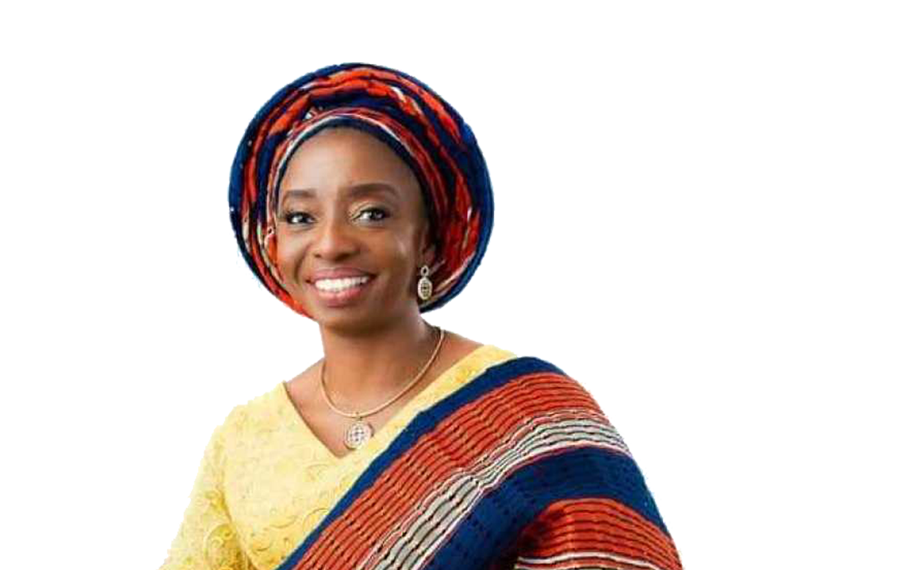 A woman wearing a warm smile with a purse in her hand