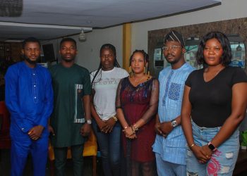 Image if six people standing indoors