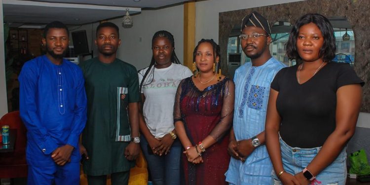 Image if six people standing indoors