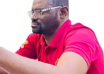 A man with glasses in a sitting position