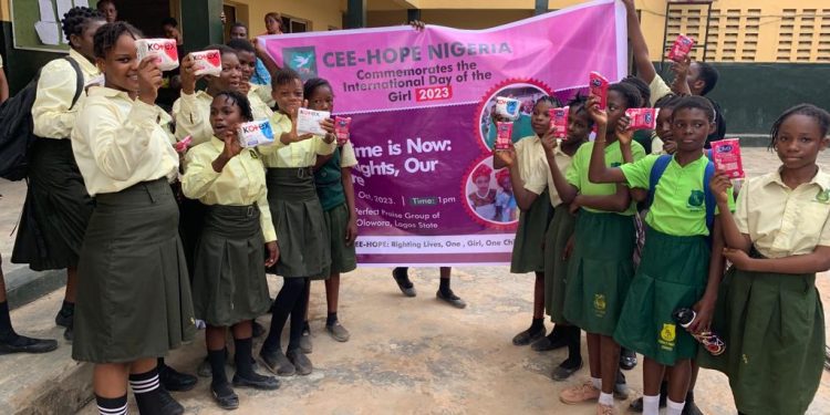 School girls holding a banner