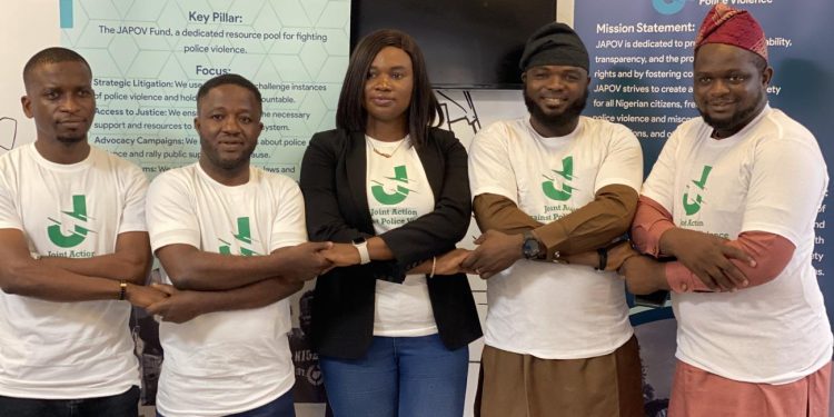 People standing together holding their hands