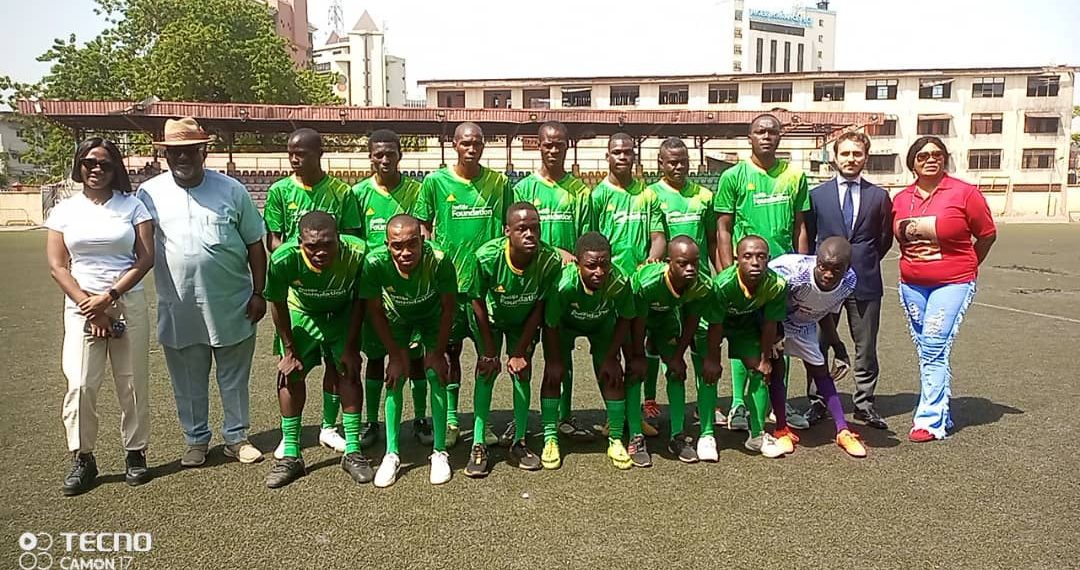 People standing on a football pitch